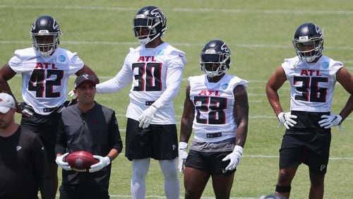 Falcons running backs Caleb Huntley (from left), Qadree Ollison, Mike Davis and Tony Brooks-James get in some work during organize team activities (OTAs) Tuesday, May 25, 2021, at the team training facility in Flowery Branch. (Curtis Compton / Curtis.Compton@ajc.com)
