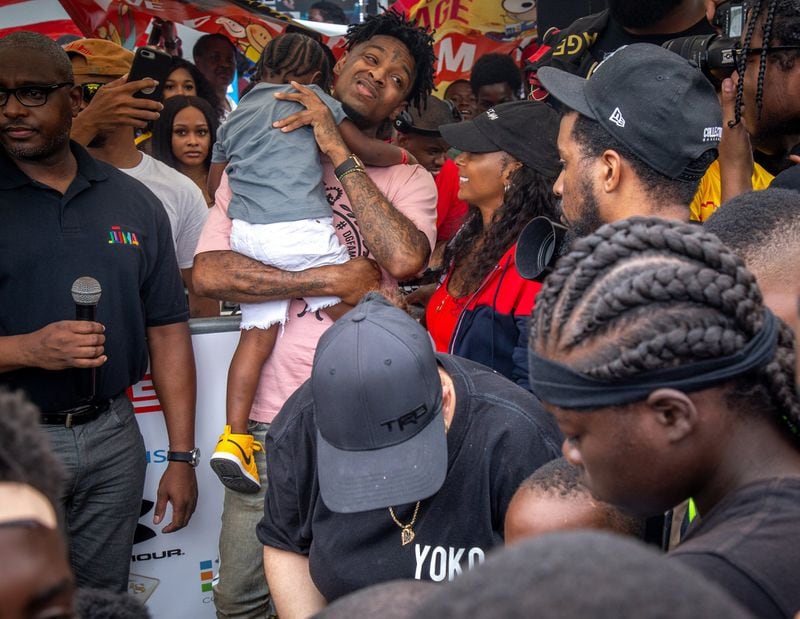 Fans surround 21 Savage as he walks into the fourth annual Issa Back 2 School Drive in Decatur in 2019.