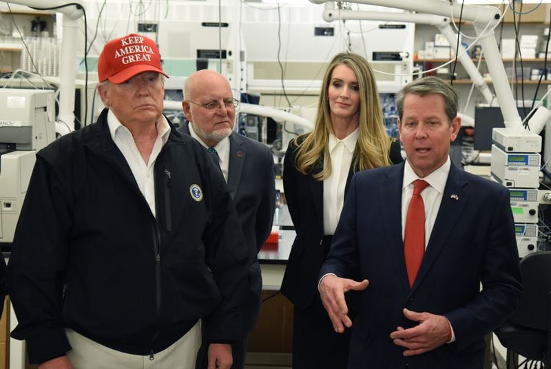 Gov. Brian Kemp speaks at the headquarters of the Centers for Disease Control and Prevention in Atlanta on March 6, 2020, as President Donald Trump, CDC director Dr. Robert Redfield, and U.S. Sen. Kelly Loeffler listen. (Hyosub Shin / Hyosub.Shin@ajc.com)