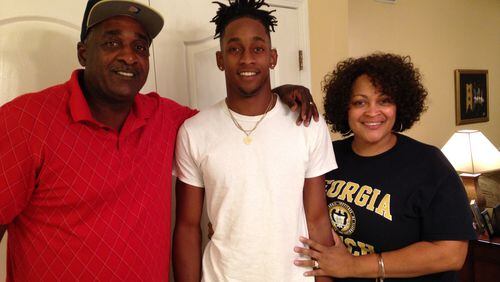 Georgia Tech freshman safety Kaleb Oliver with his parents Kevin Sr. and Hope in their home in La Vergne, Tenn. (AJC photo by Ken Sugiura)
