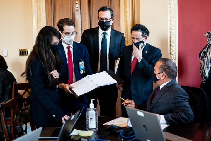 From right: House impeachment managers Rep. David Cicilline (D-R.I.), and Rep. Jamie Raskin (D-Md.), work on their remarks for the first day of the Senate impeachment trial of former President Donald Trump in an anteroom off the Senate floor, as aides look on, at the Capitol in Washington, Tuesday, Feb. 9, 2021. The second impeachment trial of former President Trump is scheduled to began on Tuesday, about a month after he was charged by the House with incitement of insurrection for his role in egging on a violent mob that stormed the Capitol on Jan. 6. (Erin Schaff/The New York Times)