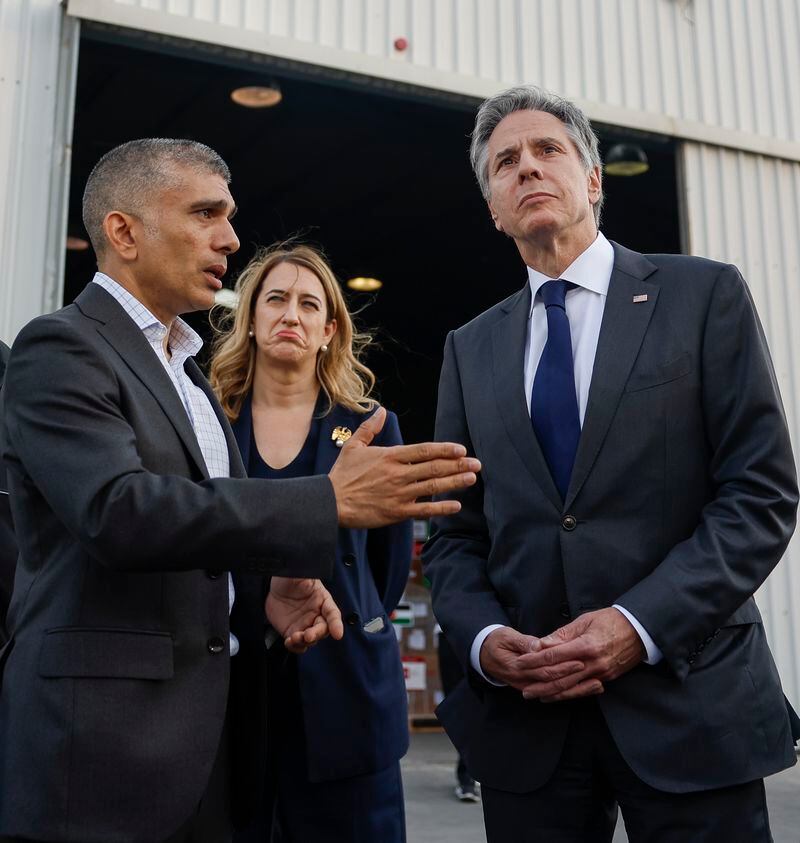 U.S. Secretary of State Antony Blinken speaks with Prince Rashid, Head of the Board of Trustees for JHCO as they visit a storage with humanitarian aid bound for Gaza at the Jordanian Hashemite Charity Organization in Amman, Jordan, April 30, 2024. (Evelyn Hockstein/Pool Photo via AP)