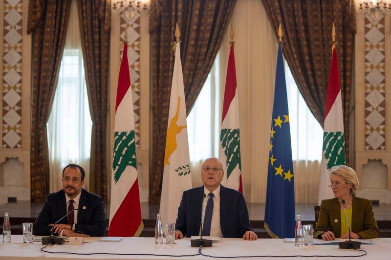 Lebanese caretaker Prime Minister Najib Mikati, center, speaks during his meeting with Cyprus' President Nikos Christodoulides, left, and President of the European Commission Ursula von der Leyen at the government palace in Beirut, Lebanon, Thursday, May 2, 2024. (AP Photo/Hassan Ammar)