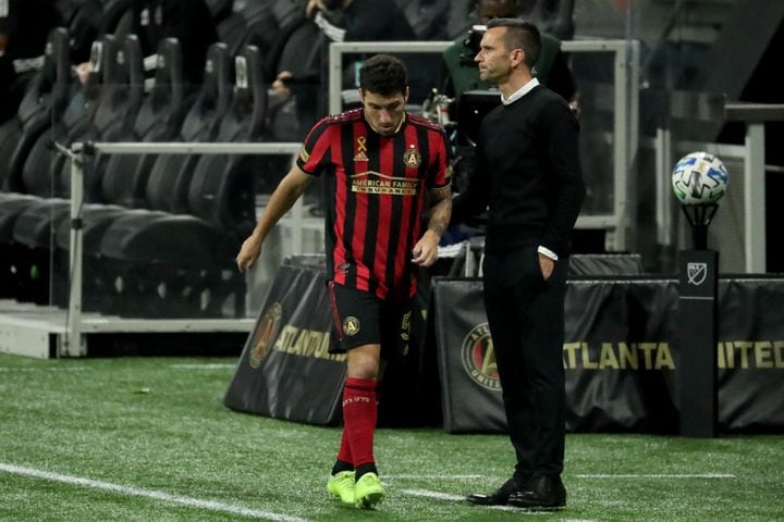 Atlanta United interim head coach Stephen Glass greets midfielder Eric Remedi, left, as he returns to the bench in the second half against Miami at Mercedes-Benz Stadium Saturday, September 19, 2020 in Atlanta. Atlanta United lost to Miami 2-1. JASON GETZ FOR THE ATLANTA JOURNAL-CONSTITUTION