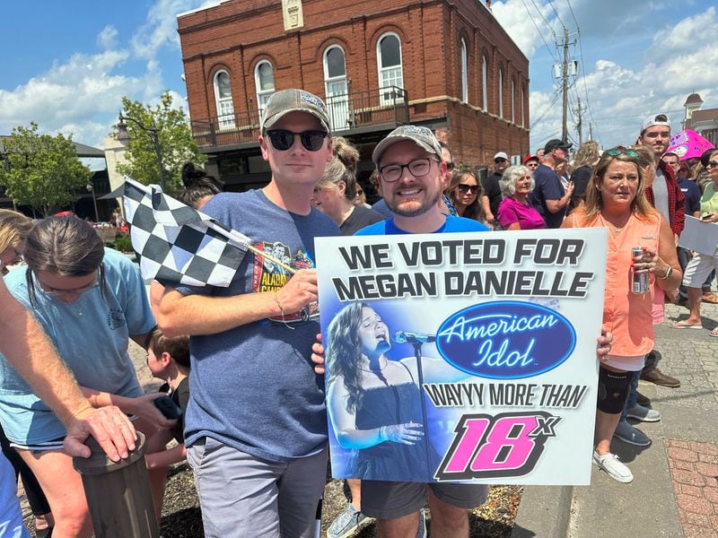 Megan Danielle fans Mitchell Jenkins, 25, and his boyfriend Hayden Gay, 28, drove from Alabama to see her.  They know her uncle, who is in racing. "She has a good hometown feel," Jenkins said. "She's very humble." RODNEY HO/rho@ajc.com