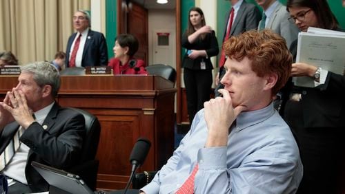 In this photo taken March 9, 2017, House Energy and Commerce Committee  member Rep. Joseph P. Kennedy III, D-Mass., joined at left by Rep. Kurt Schrader, D-Ore., listens on Capitol Hill in Washington as debate continues after working through the night with members of the committee on the GOP's "Obamacare" replacement bill. A familiar name from Massachusetts is carrying his family legacy into a new era, battling Republicans who want to undo Barack Obamaâs health care law. (AP Photo/J. Scott Applewhite)