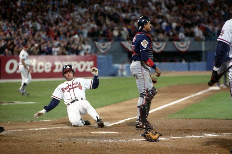 Mark Lemke scores a run in Game 2 of the 1995 World Series.