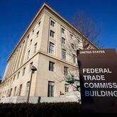 FILE - The Federal Trade Commission building is seen, Jan. 28, 2015, in Washington. U.S. companies would no longer be able to bar employees from taking jobs with competitors under a rule approved by the FTC on Tuesday, April 23, 2024, though the rule seems sure to be challenged in court. (AP Photo/Alex Brandon, File)
