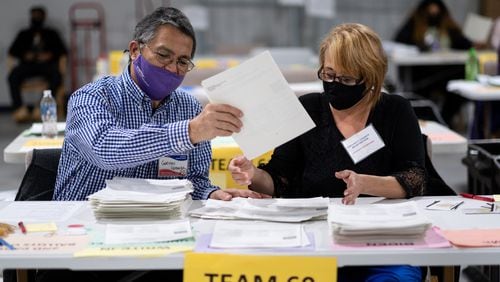Workers conduct an audit and manual recount of ballots at the Gwinnett County election warehouse in Lawrenceville in November 2020. Ben Gray for The Atlanta Journal-Constitution