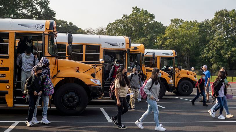 08/02/2021 —Marietta, Georgia — Pearson Middle School students exit their busses during the first day of school at Pearson Middle School in Marietta, Monday, August 2, 2021. (Alyssa Pointer/Atlanta Journal Constitution)