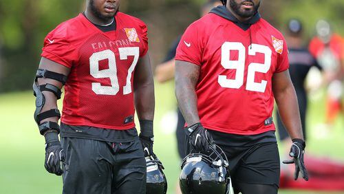 June 13, 2017, Flowery Branch: Atlanta Falcons defensive tackles Dontari Poe (right) and Grady Jarrett walk off the field at the conclusion of the first day of mini-camp on Tuesday, June 13, 2017, in Flowery Branch. Curtis Compton/ccompton@ajc.com