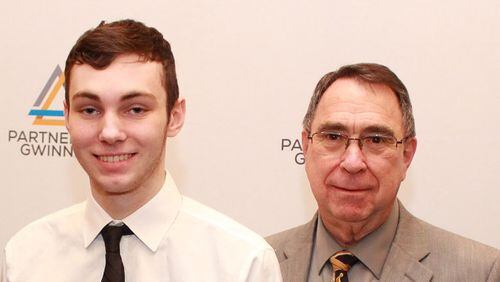 Mountain View High School senior Adam Hordines, left, named Billy Jones as the teacher who influenced him most, at an honors luncheon for STAR Students and STAR Teachers in Gwinnett County. COURTESY OF PARTNERSHIP GWINNETT