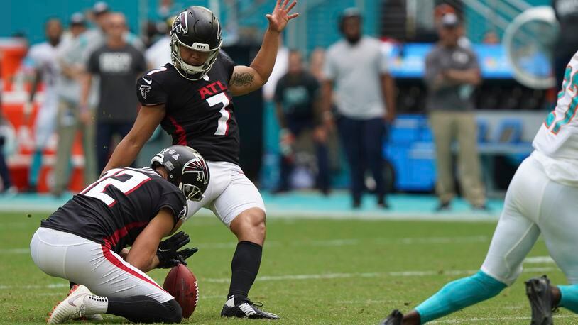 Falcons kicker Younghoe Koo (7) kicks the winning field goal, as the ball is held by punter Dustin Colquitt (12), during the final seconds against the Miami Dolphins, Sunday, Oct. 24, 2021, in Miami Gardens, Fla. The Falcons won 30-28. (Hans Deryk/AP)