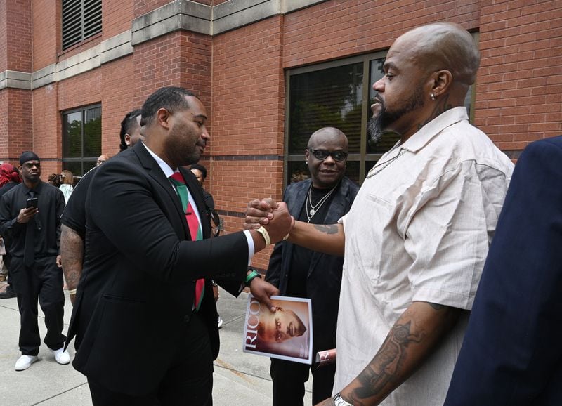 Historian Maurice Hobson and Dungeon Family member Big Rube greet following the funeral service of Rico Wade at Ebenezer Baptist Church on Friday, April 26, 2024. Rico Wade, an architect of Southern Hip Hop and one-third of the Grammy-nominated, multi-platinum-selling legendary production team Organized Noize and the de facto leader of The Dungeon Family, will be eulogized privately and by invitation only for family and friends on Friday, April 26, 2024. (Hyosub Shin / AJC)