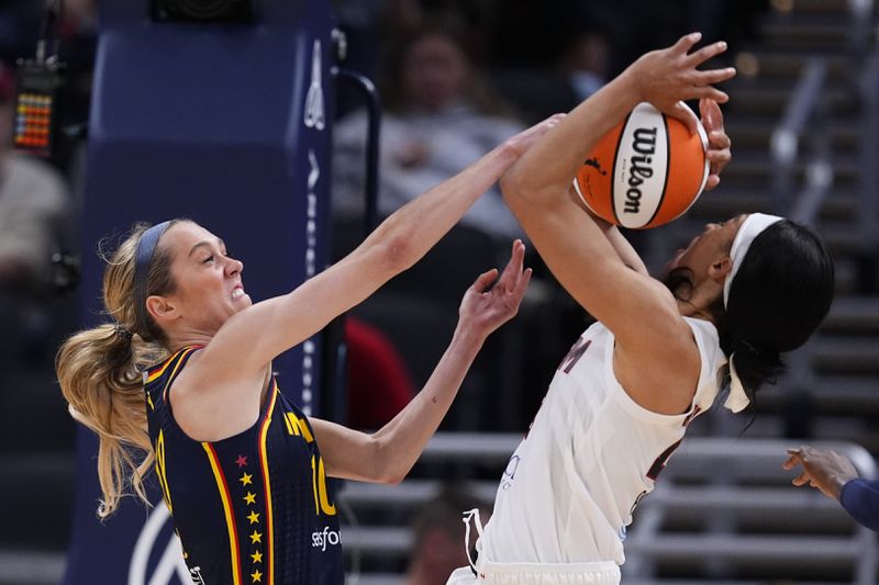 Indiana Fever's Lexie Hull (10) blocks the shot of Atlanta Dream's Aerial Powers during the second half of a WNBA preseason basketball game Thursday, May 9, 2024, in Indianapolis. (AP Photo/Darron Cummings)