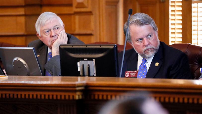 Sen. Jack Hill, R-Reidsville, (left) and Rep. Terry England, R-Auburn, chairmen of the Legislature’s budget committees, listen as Georgia Gov. Brian Kemp talks about his budget plans in 2019. Bob Andres / bandres@ajc.com