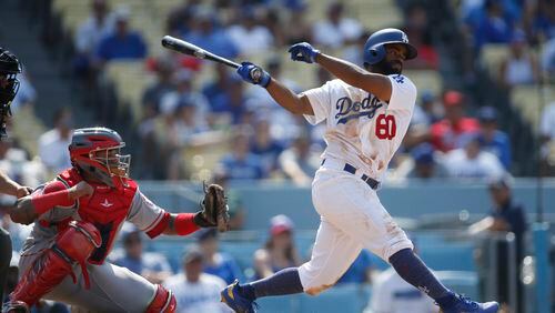 The Los Angeles Dodgers' Andrew Toles hits an RBI single in 2018. (AP Photo/Danny Moloshok)