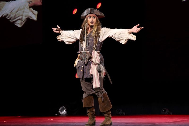 Actor Johnny Depp,  dressed as Captain Jack Sparrow, of PIRATES OF THE CARIBBEAN: DEAD MEN TELL NO TALES took part in "Worlds, Galaxies, and Universes: Live Action at The Walt Disney Studios" presentation at Disney's D23 EXPO 2015 in Anaheim, Calif.  (Photo by Jesse Grant/Getty Images for Disney)