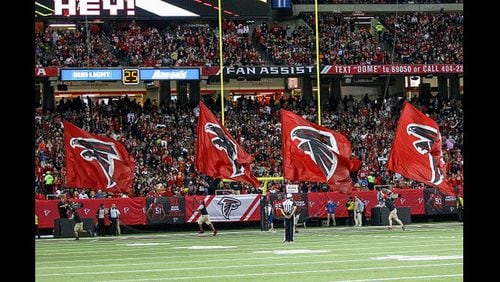 <p>Atlanta Falcons flag crew celebate after a touchdown during the NFL game between the New Orleans Saints and the Atlanta Falcons on January 01, 2017, at the Georgia Dome in Atlanta, Ga. The falcons defeat the Saints 38-32.</p>
