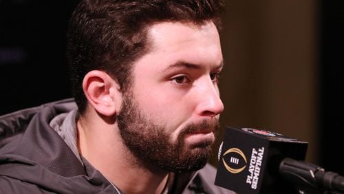 Oklahoma quarterback Baker Mayfield,  battling a flu-like illness, makes his first media appearance showing up late for the Media Day for the Rose Bowl Game  Saturday, Dec. 30, 2017, in Pasadena, Calif.