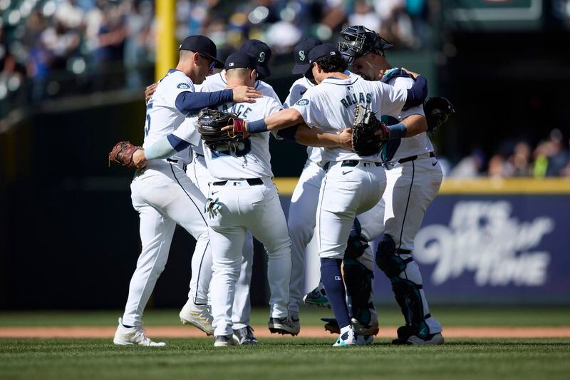 Seattle Mariners celebrate a 5-1 win over the Cincinnati Reds in a baseball game Wednesday, April 17, 2024, in Seattle. (AP Photo/John Froschauer)
