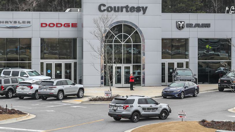 DeKalb County police were called around 11 p.m. Saturday to the Courtesy Chrysler Dodge dealership on Mall Parkway after a security guard was shot. He was taken to a hospital and later died. (John Spink / John.Spink@ajc.com)