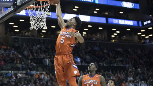 Clemson forward Jaron Blossomgame (5) dunks during the first half of an NCAA college basketball game against Duke in the Atlantic Coast Conference tournament, Wednesday, March 8, 2017, in New York. (AP Photo/Mary Altaffer)