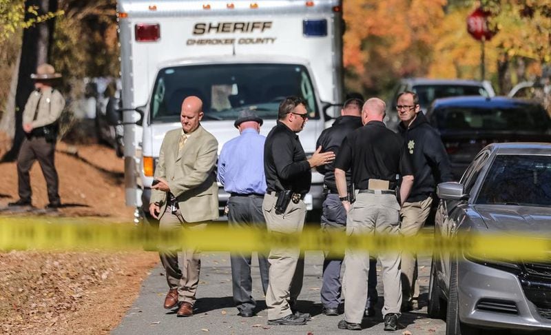 Cherokee County sheriff's deputies investigate after Karen Twilley was discovered dead outside her Woodstock home in November 2016. Her brother, Joseph Twilley, pleaded guilty, but mentally ill, to the murder.