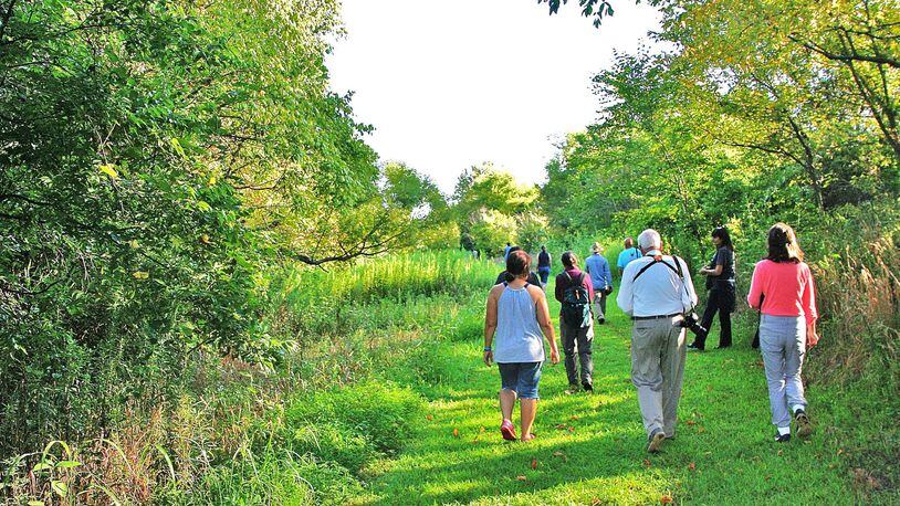 Members of the South Fork Conservancy and other conservation organizations take a walk on the Meadow Loop Trail along the south fork of Peachtree Creek. (Charles Seabrook)