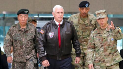 U.S. Vice President Mike Pence arrives with U.S. Gen. Vincent Brooks, second from right, commander of the United Nations Command, U.S. Forces Korea and Combined Forces Command, and South Korean Deputy Commander of the Combined Force Command Gen. Leem Ho-young, left, at the border village of Panmunjom in the Demilitarized Zone (DMZ) which has separated the two Koreas since the Korean War, South Korea, Monday, April 17, 2017. Viewing his adversaries in the distance, Pence traveled to the tense zone dividing North and South Korea and warned Pyongyang that after years of testing the U.S. and South Korea with its nuclear ambitions, "the era of strategic patience is over." (AP Photo/Lee Jin-man)