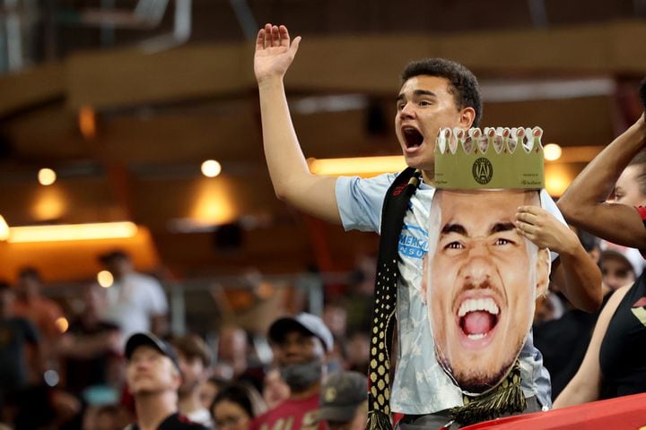 An Atlanta United fan holds a photograph of forward Josef Martinez during the second half against D.C. United at Mercedes Benz Stadium Saturday, September 18, 2021 in Atlanta, Ga.. JASON GETZ FOR THE ATLANTA JOURNAL-CONSTITUTION