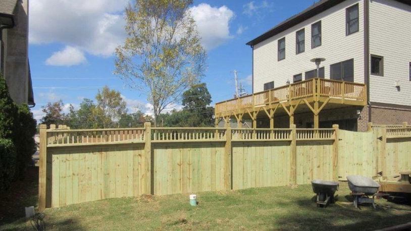 This 6-foot tall fence at 135 Autry St. will need to be reduced to four feet tall or removed to comply with a Norcross city ordinance. Courtesy City of Norcross