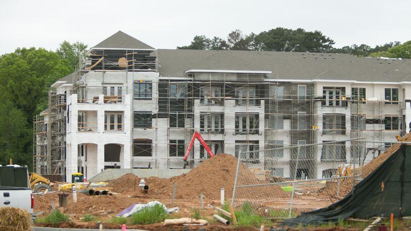 2015 construction of apartments at  Gateway mixed-use development. Three years earlier, two older apartment communities were demolished to make way for the construction.  PHOTO / JASON GETZ