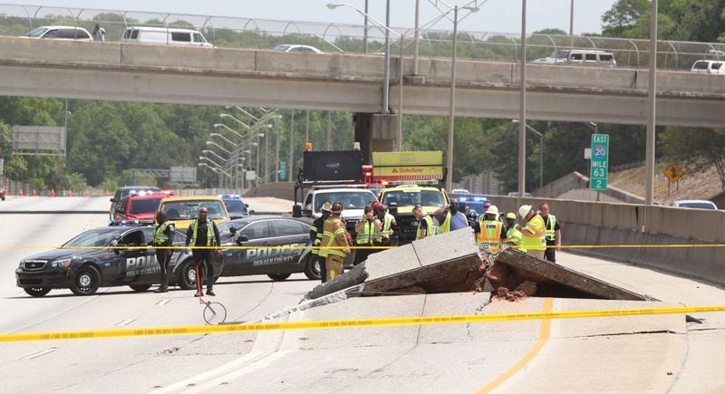 Traffic was diverted from I-20 West after the road buckled. HENRY TAYLOR / HENRY.TAYLOR@AJC.COM