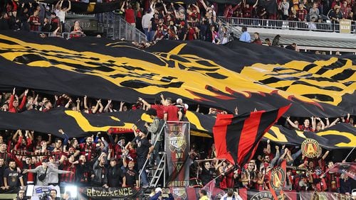 March 5, 2017, Atlanta: Fans unfurl the Atlanta United RC tifo to open the action against the N.Y. Red Bulls during their first game in franchise history on Sunday, March 5, 2017, in Atlanta.   Curtis Compton/ccompton@ajc.com