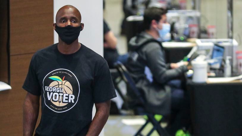 Hawks coach Lloyd Pierce was a poll volunteer on Monday, Oct. 12, 2020 at State Farm Arena in downtown Atlanta. (John Spink / John.Spink@ajc.com)