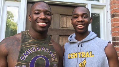 Georgia Tech freshman linebacker Cornelius Evans (right) with his brother Donta (a junior linebacker at Ole Miss) in front of their family's home in Lawrenceville on May 15, 2019. Evans grew up enamored with his older brother. "If I said something, he would repeat it," Donta said. "Every single time. We were always really close."