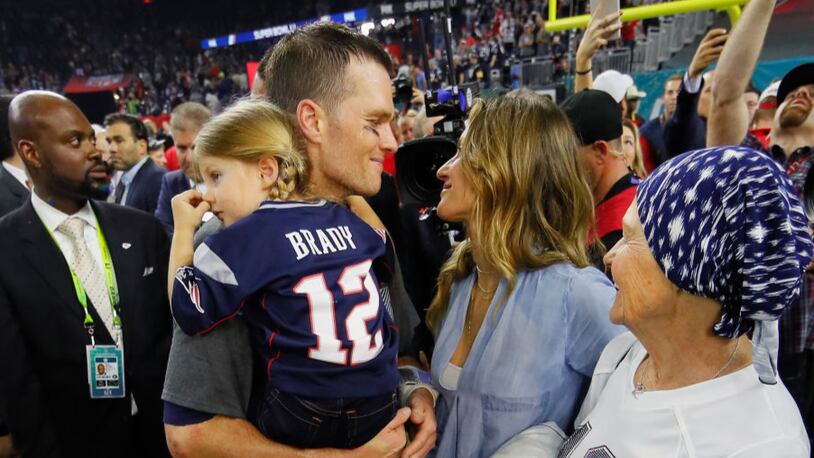 HOUSTON, TX - FEBRUARY 05:  Tom Brady #12 of the New England Patriots celebrates with wife Gisele Bundchen and daughter Vivian Brady after defeating the Atlanta Falcons during Super Bowl 51 at NRG Stadium on February 5, 2017 in Houston, Texas. The Patriots defeated the Falcons 34-28.  (Photo by Kevin C. Cox/Getty Images)