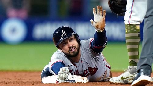 Atlanta Braves' Travis d'Arnaud is safe at second with a double during the first inning of the team's baseball game against the Miami Marlins, Friday, May 20, 2022, in Miami. (AP Photo/Lynne Sladky)