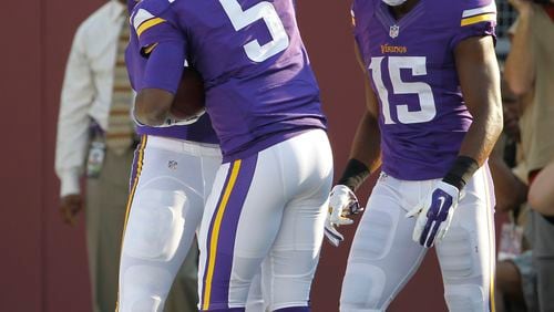 Minnesota Vikings quarterback Teddy Bridgewater (5) celebrates with teammates after a 13-yard touchdown run in the first half of an NFL football game against the Atlanta Falcons , Sunday, Sept. 28, 2014, in Minneapolis. (AP Photo/Ann Heisenfelt) Teddy Bridgewater celebrates after his 13-yard touchdown run. (AP photo)