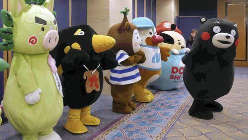Mascots from Kyushu gather at an ANA Holdings event in Tokyo to promote tourism to the region on Tuesday. PHOTO: The Japan News/Yomiuri