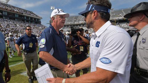 September 30, 2017 Atlanta -Georgia Tech head coach Paul Johnson and North Carolina head coach Larry Fedora shake hand after their NCAA college football game at Bobby Dodd Stadium on Saturday, September 30, 2017. Georgia Tech won 33 - 7 over the North Carolina. HYOSUB SHIN / HSHIN@AJC.COM