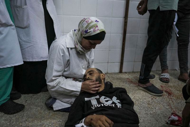 Palestinians mourn their relatives killed in the Israeli bombardment of the Gaza Strip, at the Al Aqsa hospital in Deir al Balah, Gaza, Thursday, May 9, 2024. (AP Photo/Abdel Kareem Hana)
