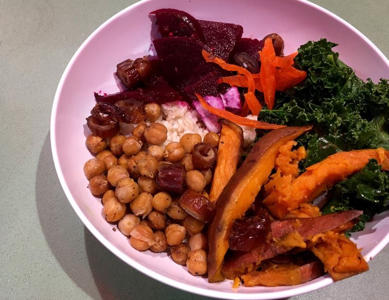 Recess loads up the super bowl with roasted sweet potato, chickpeas, pickled beets, greens, coconut brown rice, dates, and dried mango. CONTRIBUTED BY WYATT WILLIAMS