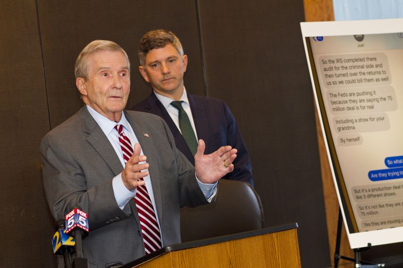 Michael Bowers give a press conference after filing a lawsuit for their clients Todd and Julie Chrisley. Christopher Anulewicz, at right, is also on the legal team handling the case.