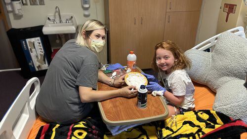During a six week stay at Children's Healthcare of Atlanta, Virginia Bicksler's spirits were boosted by doing arts and crafts with Hannah Randall, the artist in residence. Courtesy of the Bicksler family