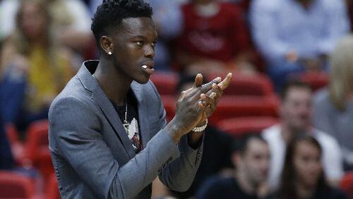 Dennis Schroder watched his Hawks teammates play hard but lose at Miami. (AP Photo)