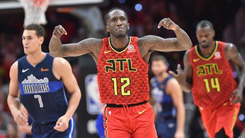 Atlanta Hawks forward Taurean Prince (12) reacts after he scored during the second half of the home opener in an NBA basketball game at State Farm Arena on Wednesday, October 24, 2018. HYOSUB SHIN / HSHIN@AJC.COM