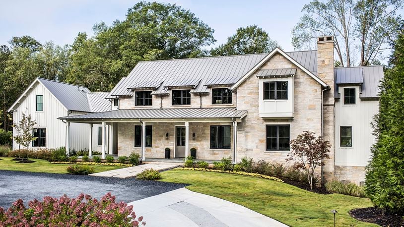 A mix of materials helps create a riff on the modern-farmhouse exterior. Photo: Courtesy of Harrison Design / Jeff Herr