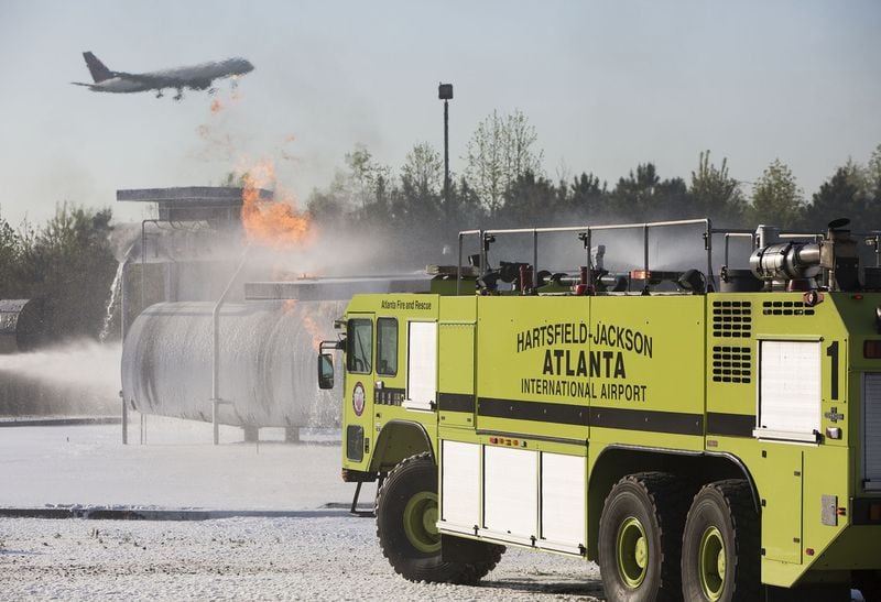 Hartsfield-Jackson International Airport held a full-scale disaster drill with Atlanta Firefighters, law enforcement, rescue personnel and nearly 150 volunteers who participated in a triennial exercise known as âBig Birdâ on Thursday, April 12, 2018. Airport personnel mobilized to a mock aircraft crash, extinguished the fire then triaged & treated the victims at a training site. The Federal Aviation Administration requires airports to conduct annual emergency preparedness drills and at least one full-scale drill every three years. (Photo by Phil Skinner)NOTE: getting Ids was impossible because the media was too far away.